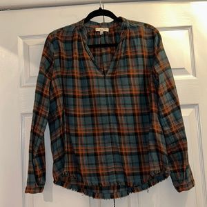 Trendy lightweight flannel top with cute frayed hem.